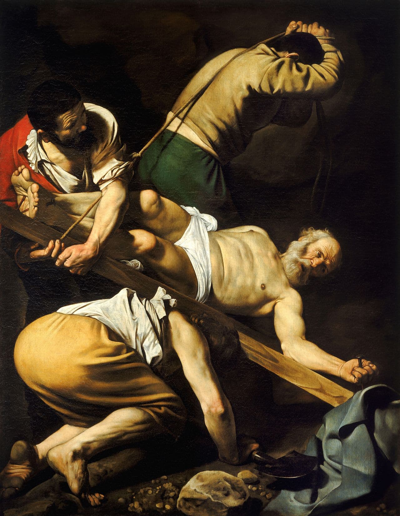 Caravaggio's Crucifixion of Saint Peter, c. 1600 — servants strain to hoist the cross as Peter is nailed upside down